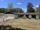 Charming single-story home featuring a two-car garage and mature landscaping in a suburban setting at 1230 Jasmine Rd, Apopka, FL 32703