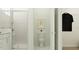 Modern bathroom featuring a glass-enclosed shower, toilet, and decorative artwork at 4572 Ochos Rios Pl, Kissimmee, FL 34758