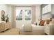 Light-filled bedroom with a comfortable bed, decorative pillows, and a view of the outdoors at 4572 Ochos Rios Pl, Kissimmee, FL 34758
