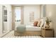 Bright bedroom with a modern bed frame, large window, and soft, inviting textures at 4572 Ochos Rios Pl, Kissimmee, FL 34758