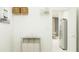 Bright laundry room with storage shelves, and stainless steel refrigerator at 4572 Ochos Rios Pl, Kissimmee, FL 34758