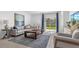 Cozy living room features a comfortable sofa, stylish coffee table, and access to a patio at 5657 Portico Pl, Kissimmee, FL 34758