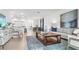 Spacious living room with an open layout, comfortable seating, and a modern decor at 5657 Portico Pl, Kissimmee, FL 34758