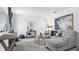 Comfortable living area with soft carpeting, stylish furnishings, and plenty of natural light at 5657 Portico Pl, Kissimmee, FL 34758