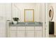 Well-lit bathroom showcasing a granite countertop, white cabinetry, and modern fixtures at 1283 Dora Parc Ln, Mount Dora, FL 32757
