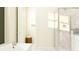 Bathroom view showcasing a tub, walk-in shower with glass enclosure, and a neutral color palette at 1283 Dora Parc Ln, Mount Dora, FL 32757