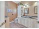 Compact bathroom with a granite countertop, white cabinets, and tiled flooring at 1709 Latta Ct, The Villages, FL 32162