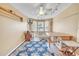 Bright bonus room featuring a large window, a ceiling fan, and a sewing area at 1709 Latta Ct, The Villages, FL 32162