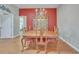 Traditional dining room features a wooden table, chairs, and a decorative china cabinet at 1709 Latta Ct, The Villages, FL 32162