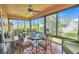 Cozy sunroom featuring tile floors, comfortable seating, and lots of natural light at 1709 Latta Ct, The Villages, FL 32162