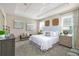 Main bedroom featuring a coffered ceiling, carpet, and well-coordinated decor at 1899 Clear Sky Dr, Kissimmee, FL 34744