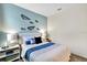 Cozy bedroom with paper airplane decor, blue accent wall, carpet floors and natural light at 1899 Clear Sky Dr, Kissimmee, FL 34744