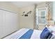 Bedroom featuring a closet, blue accents, carpet floors, and lots of natural light at 1899 Clear Sky Dr, Kissimmee, FL 34744