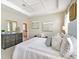 Comfortable main bedroom showcasing a trey ceiling, carpeted floors and decorative furniture at 1899 Clear Sky Dr, Kissimmee, FL 34744