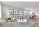 Spacious living room with a couch, accent chairs, a coffee table, and decor at 1899 Clear Sky Dr, Kissimmee, FL 34744