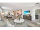 Open-concept living area with stylish furniture, adjacent to the dining and kitchen areas at 1899 Clear Sky Dr, Kissimmee, FL 34744