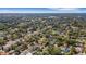 Discover the perfect setting from above, with the home highlighted in a white circle nestled within a verdant neighborhood at 2417 Coventry Ave, Lakeland, FL 33803