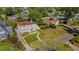 Aerial view of a beautiful neighborhood with lush greenery, stately homes, and red brick roads at 2417 Coventry Ave, Lakeland, FL 33803