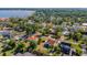 Beautiful aerial view of a neighborhood with lush trees and a waterfront in the background, showcasing the community at 2417 Coventry Ave, Lakeland, FL 33803
