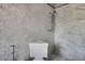 Contemporary bathroom showcasing marble walls and floor with chrome fixtures at 2417 Coventry Ave, Lakeland, FL 33803