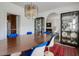 Spacious dining room with a large table, decorative cabinets, and access to other rooms, perfect for Gathering gatherings at 2417 Coventry Ave, Lakeland, FL 33803