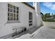Exterior of a white stucco home with a ladder near a door and window at 2417 Coventry Ave, Lakeland, FL 33803