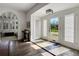 Inviting foyer with hardwood floors, an arched doorway, and a glass front door providing abundant natural light at 2417 Coventry Ave, Lakeland, FL 33803