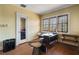 Bright home office featuring hardwood floors, desk space, and a glass door at 2417 Coventry Ave, Lakeland, FL 33803