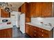 Well-lit kitchen features wooden cabinets, white countertops, and modern appliances for a functional cooking space at 2417 Coventry Ave, Lakeland, FL 33803