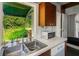 Bright kitchen area featuring ample counter space, natural light, and modern appliances, perfect for cooking enthusiasts at 2417 Coventry Ave, Lakeland, FL 33803
