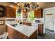 Vintage kitchen with center island, wood cabinets, and modern appliances at 2417 Coventry Ave, Lakeland, FL 33803