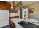 Kitchen with white countertops, wooden cabinets, and stainless steel appliances offers a blend of style and functionality at 2417 Coventry Ave, Lakeland, FL 33803