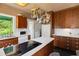 Bright kitchen boasts stainless steel appliances, wood cabinets, and a view of the outdoors, perfect for modern living at 2417 Coventry Ave, Lakeland, FL 33803