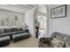 Comfortable living room with an arched doorway, cozy seating, and natural light streaming in from the doorway at 2417 Coventry Ave, Lakeland, FL 33803