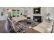 Comfortable living room with a fireplace, stylish decor, and ample seating perfect for entertaining guests at 2417 Coventry Ave, Lakeland, FL 33803