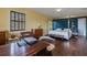 Bright bedroom featuring hardwood floors, a four poster bed, and a workspace at 2417 Coventry Ave, Lakeland, FL 33803