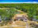 Scenic aerial view of a home with a pond, lush greenery, and beautiful landscaping at 9526 Turkey Oak Bnd, Orlando, FL 32817