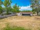 Expansive backyard featuring a screen enclosed patio and partial fence to ensure privacy at 9526 Turkey Oak Bnd, Orlando, FL 32817