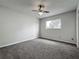 Bright bedroom with ceiling fan and natural light from a double-hung window at 9526 Turkey Oak Bnd, Orlando, FL 32817