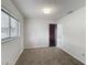 Bedroom with window and carpeted flooring features access to an ensuite bathroom at 9526 Turkey Oak Bnd, Orlando, FL 32817