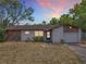 Inviting single-story home displaying a cozy facade and attached garage at 9526 Turkey Oak Bnd, Orlando, FL 32817