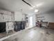 Spacious garage area equipped with washer, dryer, workbench, and additional storage space at 9526 Turkey Oak Bnd, Orlando, FL 32817