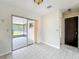 Open-concept living room featuring tile floor, neutral walls and glass sliding door at 9526 Turkey Oak Bnd, Orlando, FL 32817