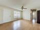 Comfortable living room featuring hardwood floors, a ceiling fan, and a welcoming entrance at 9526 Turkey Oak Bnd, Orlando, FL 32817