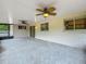 Spacious screened-in patio featuring two ceiling fans and access to the backyard at 9526 Turkey Oak Bnd, Orlando, FL 32817