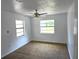 Bedroom featuring cozy carpet, neutral walls, and natural light from windows at 5045 Swindell Rd, Lakeland, FL 33810