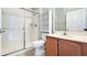 Beautiful bathroom features a glass shower, tile flooring, toilet, and vanity with a sink and storage at 2352 Grand Central Pkwy # 18, Orlando, FL 32839