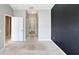 View of the bedroom leading to bathroom with a closet and plenty of carpeted floor space at 2352 Grand Central Pkwy # 18, Orlando, FL 32839