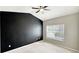 Bright bedroom enhanced with a large window offering natural light and a ceiling fan for added comfort at 2352 Grand Central Pkwy # 18, Orlando, FL 32839