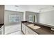 Modern kitchen with stainless steel appliances and a breakfast bar overlooking the spacious living area at 2352 Grand Central Pkwy # 18, Orlando, FL 32839
